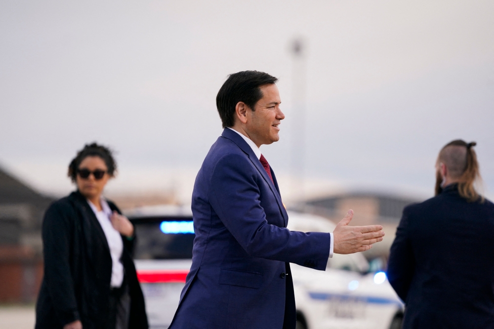 US Secretary of State Marco Rubio arrives at Joint Base Andrews in Maryland to board a plane for Jamaica on March 26, 2025. Rubio heads to the Caribbean looking for ways forward on violence-torn Haiti and to show support for oil-rich Guyana in its dispute with Venezuela. — Nathan Howard/Pool/AFP 