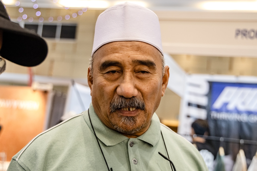 Shopper Mustaza Musa, 61, came to the Selangor Havoc Raya Fest with his wife and daughter from Seremban. — Picture by Firdaus Latiff 