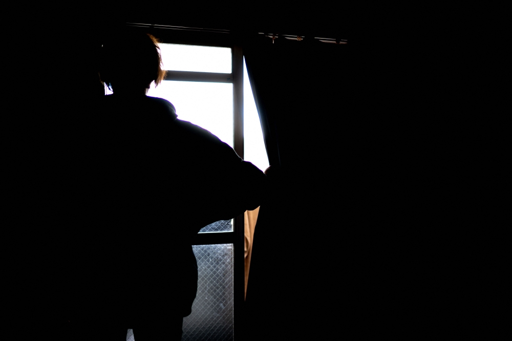 The son of death-row inmate Masumi Hayashi, who goes by the pseudonym of Koji Hayashi, during an interview at his apartment in Wakayama city. — AFP
