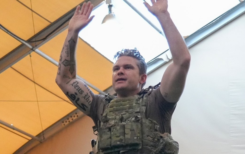 Pete Hegseth’s tattoos are visible in this photo he posted on Twitter.