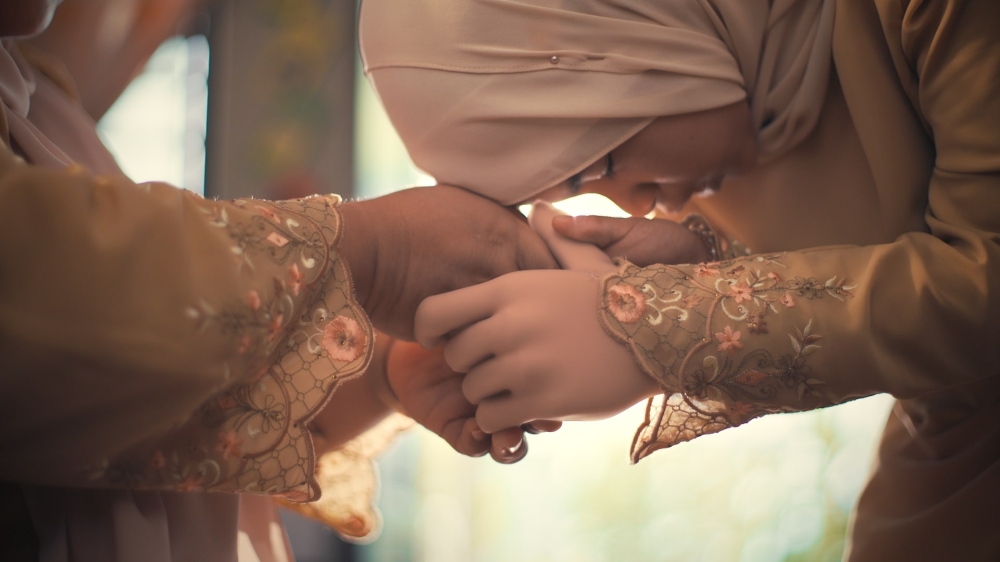 As part of its Hari Raya initiative Projek Salam, Maybank has gifted a prosthetic arm to Nur Balqis Zharah, a young girl born without her left hand. — Picture courtesy of Maybank