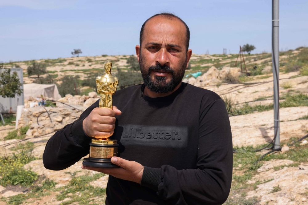 Palestinian filmmaker and Oscar winner for the documentary 
