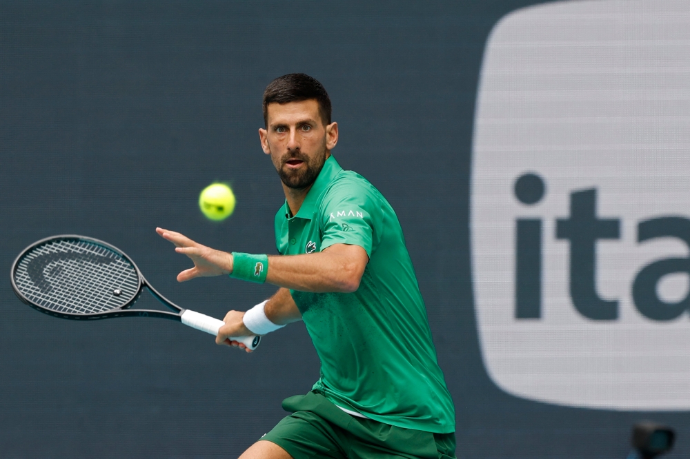 Novak Djokovic hits a forehand against Grigor Dmitrov in the Miami Open at Hard Rock Stadium. — Geoff Burke-Imagn Images via Reuters pic