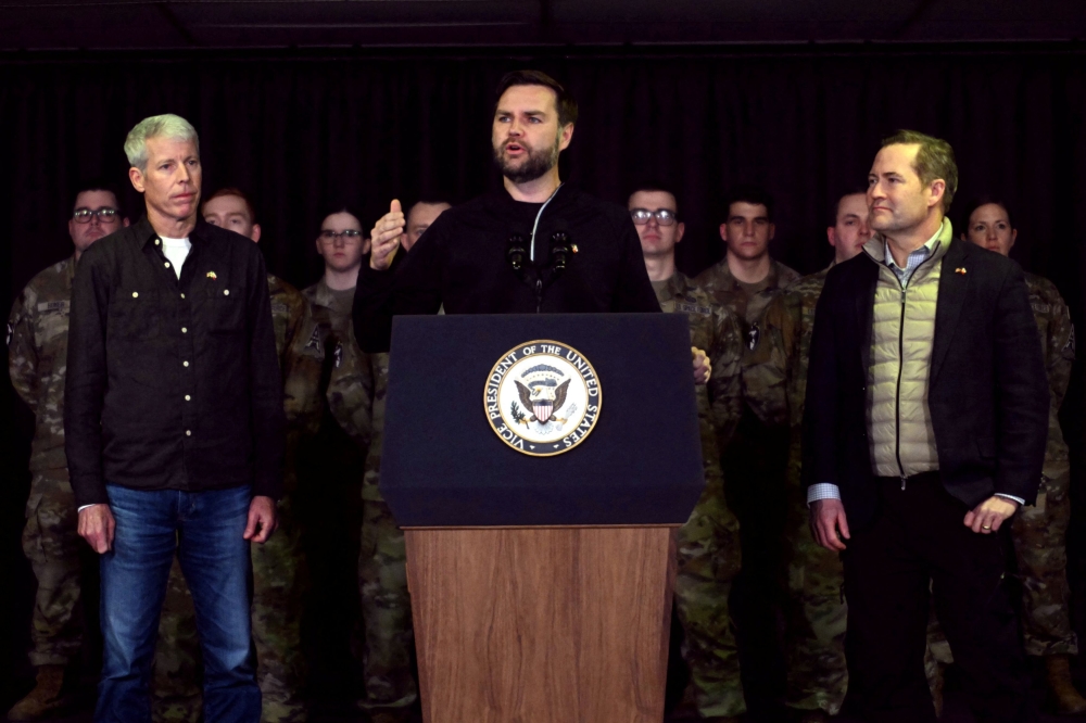 US Vice President JD Vance, flanked by Secretary of Energy Chris Wright and National Security Advisor Mike Waltz, speaks at the US. military's Pituffik Space Base in Greenland on March 28, 2025. — Reuters pic