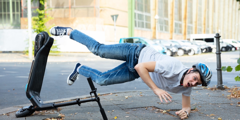 If you don't place both hands on the handlebars of your e-scooter there's a higher risk of accidents. — Shutterstock via ETX Studio pic