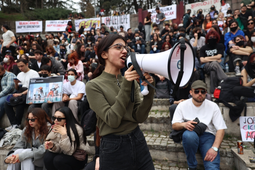 Students take part in a rally in support of Istanbul mayor, nine days after his arrest, at Seymenler Park in Ankara. — AFP pic