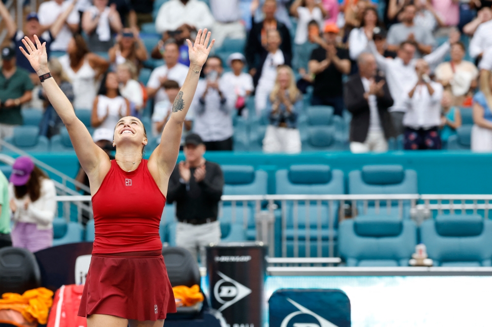 Aryna Sabalenka celebrates after her match against Jessica Pegula in the women's singles championship of the Miami Open at Hard Rock Stadium. — Geoff Burke-Imagn Images/Reuters pic