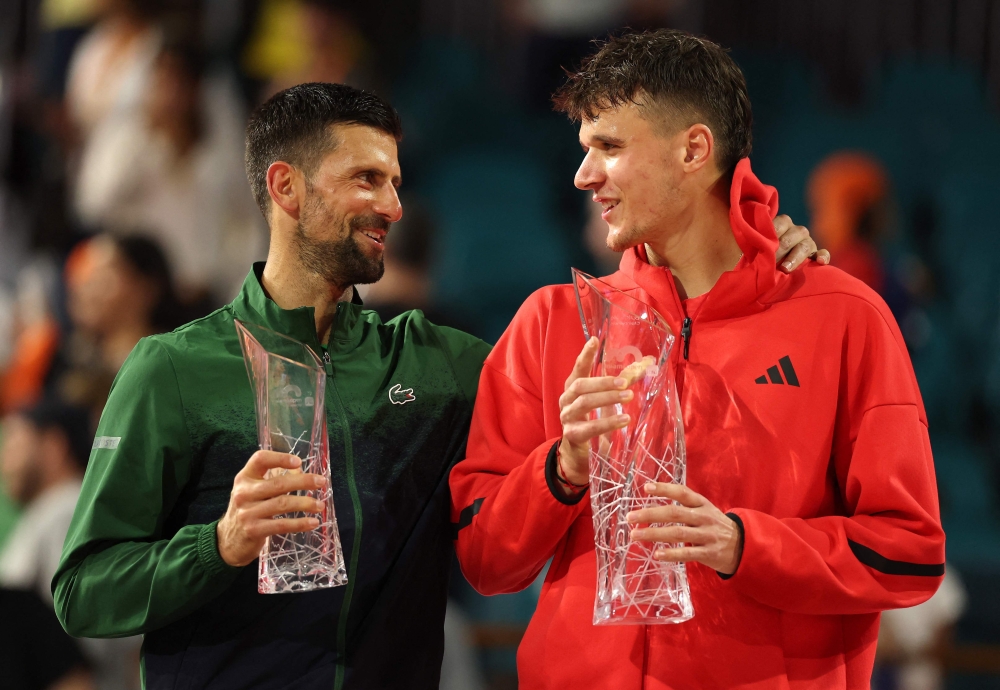Czech teenager Jakub Mensik upset Novak Djokovic 7-6 (7/4), 7-6 (7/4) to win the Miami Open at Hard Rock Stadium on Sunday, denying the Serb his 100th career title. — AFP pic