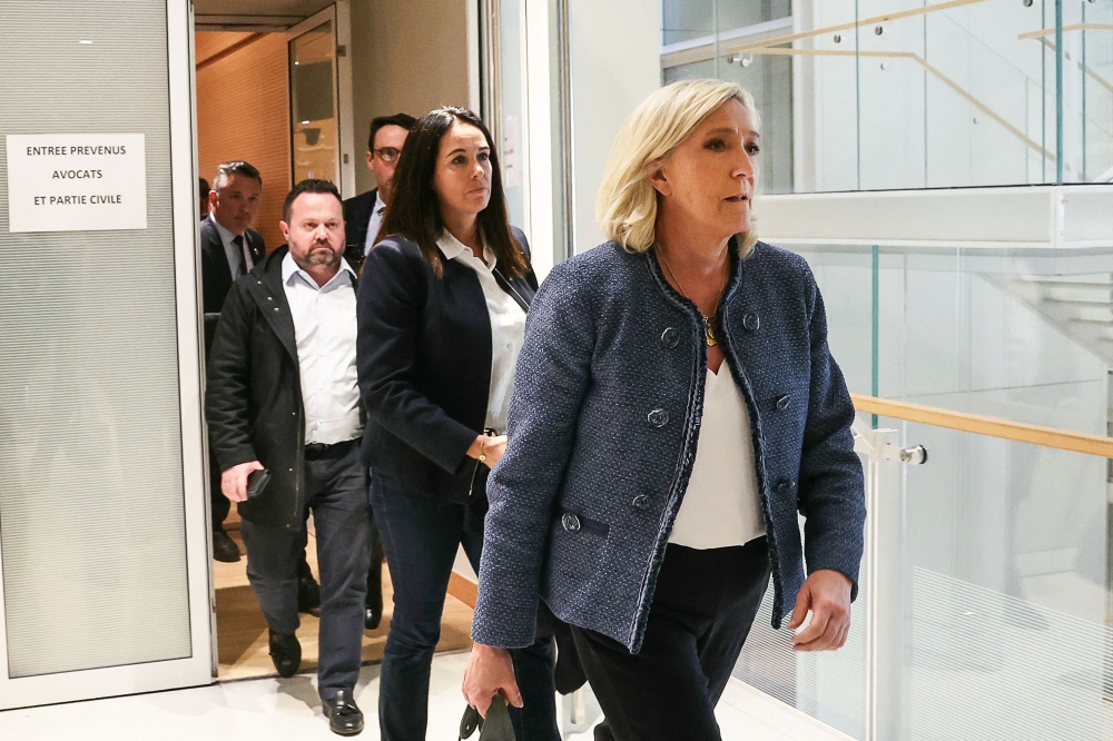 A French court on Monday banned far-right leader Marine Le Pen from running for office after her conviction over a fake jobs scheme. — AFP pic