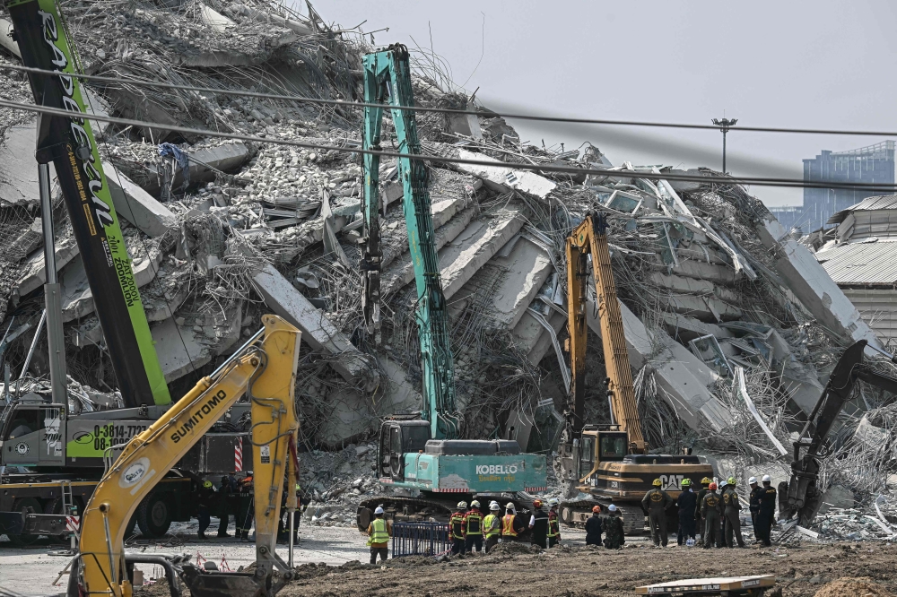 Authorities in Thailand are investigating possible factors that led to the devastating collapse of a Bangkok construction site, where dozens remained missing on Monday, three days after a massive earthquake centred in Myanmar. — AFP pic