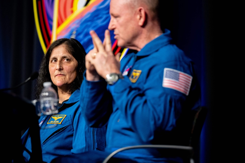 (L-R) Astronauts Sunita Williams, and Barry Wilmore speak during a news conference at the NASA Johnson Space Center yesterday. — AFP pic