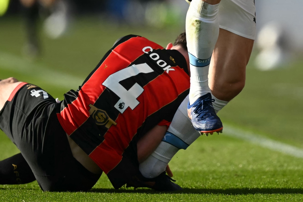 Manchester City's Norwegian striker #09 Erling Haaland (R) is hurt in this challenge with Bournemouth's English midfielder #04 Lewis Cook (L) during the English FA Cup quarter-final football match between Bournemouth and Manchester City at the Vitality Stadium in Bournemouth. — AFP pic