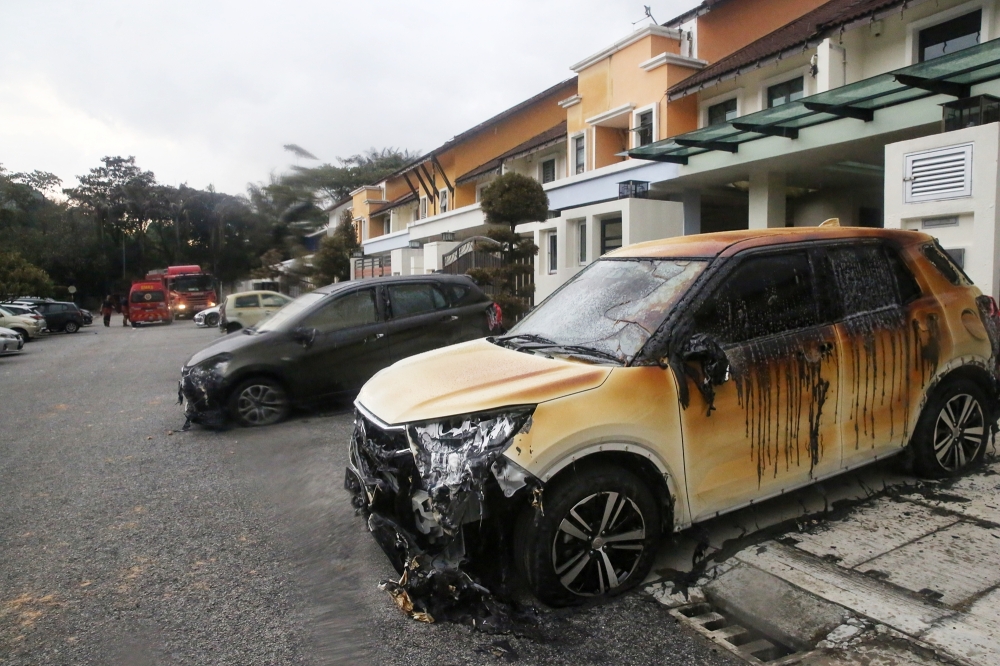 Burnt cars and houses are seen at Taman Harmoni in Putra Heights after the gas pipeline fire April 1, 2025. — Picture by Choo Choy May