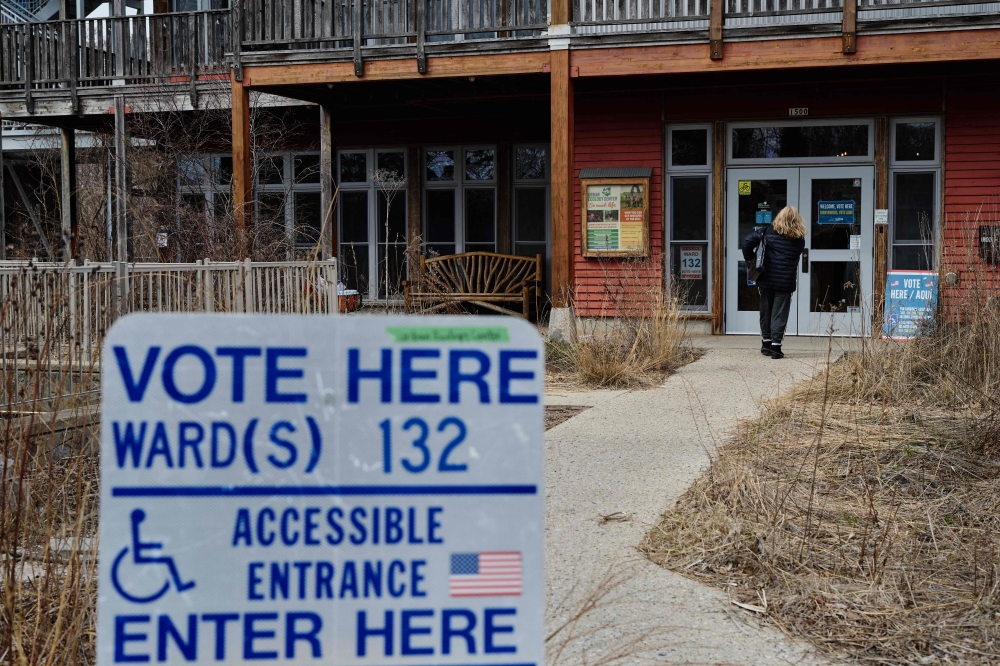 A voter enters a polling location at the Urban Ecology Center during the statewide elections yesterday in Waukesha, Wisconsin. — AFP