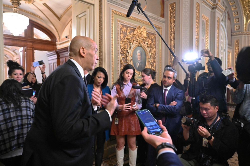 US Senator Cory Booker speaks to the press at the US Capitol in Washington on April 1. — AFP pic