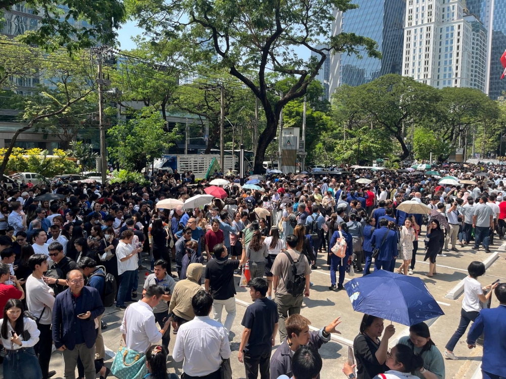 People gather on a street after a strong earthquake struck central Myanmar on Friday, earthquake monitoring services said, which affected Bangkok as well with hundreds of people pouring out of buildings in the Thai capital in panic after the tremors, in Bangkok March 28, 2025. — Reuters pic  