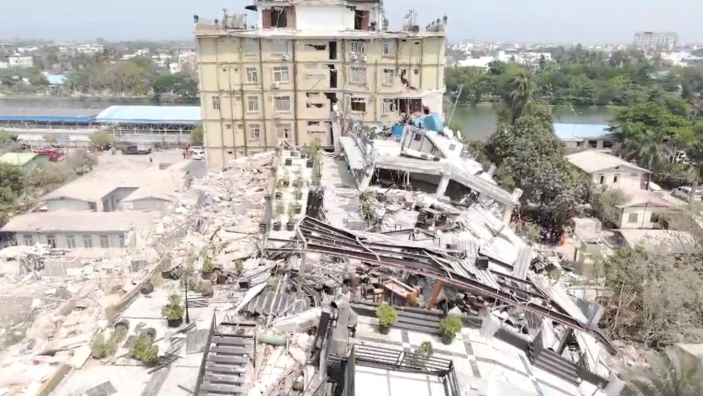 An aerial view shows flattened buildings and one damaged following an earthquake on March 28, in a location given as Mandalay region, Myanmar, in this screen grab obtained from a social media video released March 31, 2025. — Picture via Facebook/Myanmar Fire Services Department via Reuters