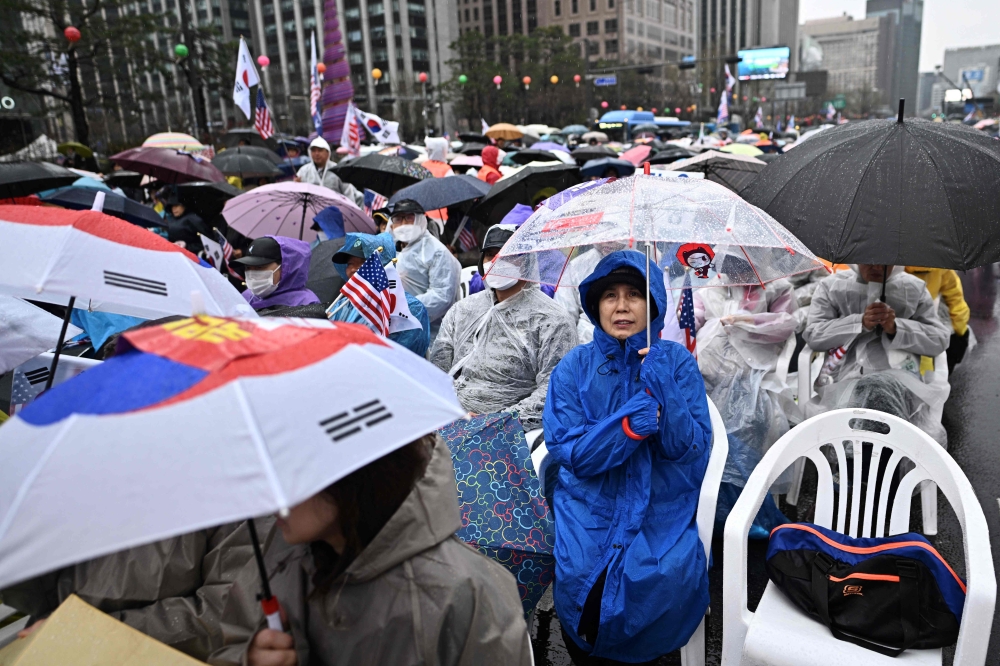 Supporters of impeached South Korean president Yoon Suk Yeol attend a rally on a street in Seoul on April 5, 2025. — AFP pic