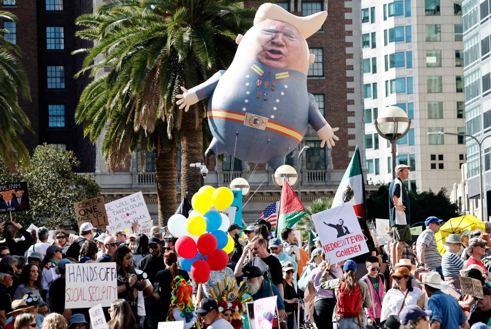 Protestors demonstrate at a 'Hands Off!' protest against the Trump administration on April 5, 2025 in Los Angeles, California. — Getty Images via AFP pic