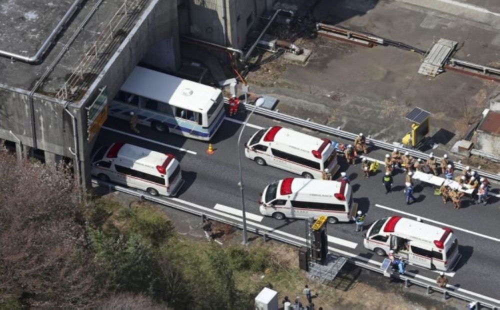 Photo taken from a Kyodo News helicopter showing part of a tour bus that was involved in the collision. — Bernama pic