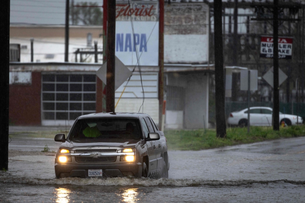 A truck drives through floodwater on April 05, 2025 in Cairo, Illinois. — Getty Images via AFP pic