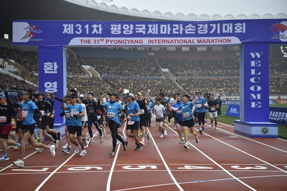 Participants of the 31st Pyongyang International Marathon at Kim Il-sung Stadium in Pyongyang today. — AFP pic