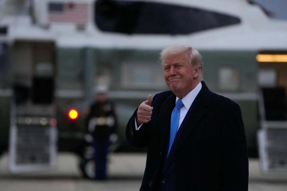 US President Donald Trump gestures as he arrives at Joint Base Andrews in Maryland, U.S., April 6, 2025. — Reuters pic