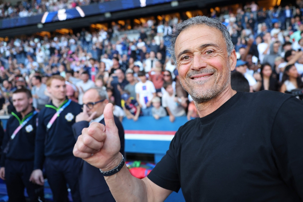 Paris Saint-Germain's Spanish headcoach Luis Enrique celebrates after winning the match and the French championship title following the French L1 football match between Paris Saint-Germain (PSG) and SCO Angers at The Parc des Princes Stadium in Paris April 5, 2025. — AFP pic