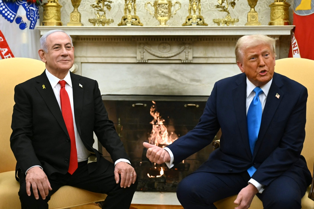 US President Donald Trump (right) meets with Israel's Prime Minister Benjamin Netanyahu in the Oval Office of the White House in Washington, DC, on February 4, 2025. Netanyahu is expected to visit the White House today, according to a senior US official. — AFP pic