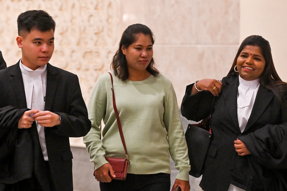 Loh Siew Hong (centre) and her lawyers at the Palace of Justice in Putrajaya May 14, 2024. — Picture by Miera Zulyana