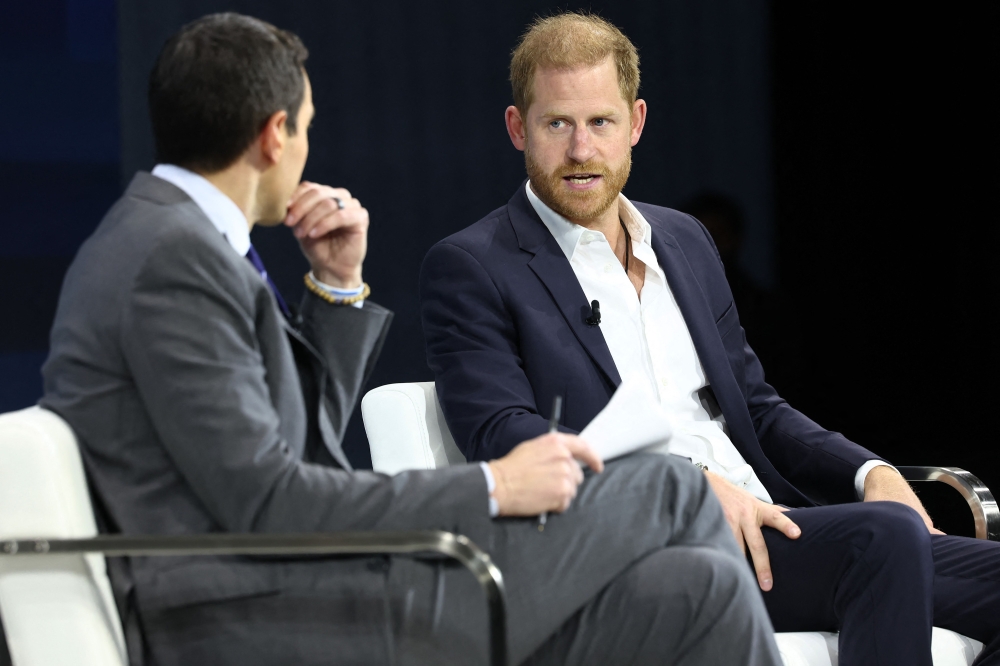 NYT columnist Andrew Ross Sorkin and Prince Harry, The Duke of Sussex, speak during the New York Times annual DealBook summit at Jazz at Lincoln Centre in New York December 4, 2024. — AFP pic 