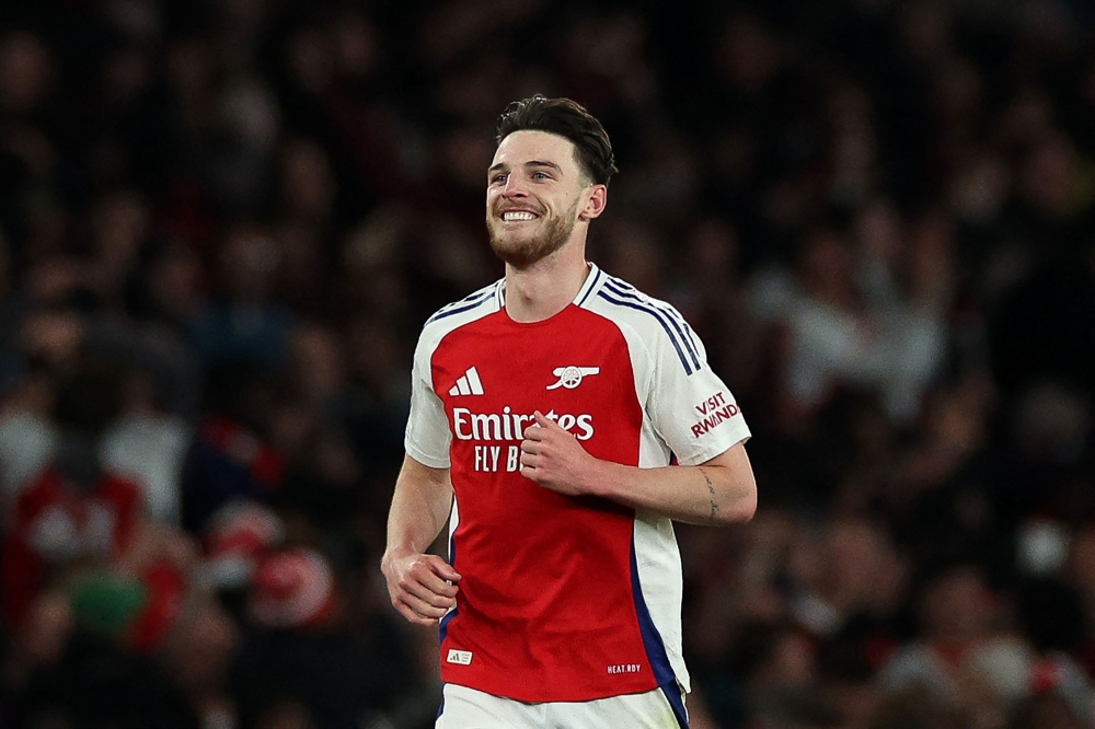 Arsenal's English midfielder #41 Declan Rice celebrates scoring the team's second goal during the UEFA Champions League Quarter final first leg football match between Arsenal and Real Madrid, at the Emirates Stadium, in London, on April 8, 2025. — AFP pic