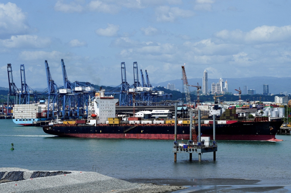 A ship sails near the Balboa Port after Hong Kong's CK Hutchison Holdings Ltd agreed to sell its interests in a key Panama Canal port operator to a BlackRock Inc-backed consortium, amid pressure from U.S. President Donald Trump to curb China's influence in the region, Panama City March 4, 2025. — Reuters pic  