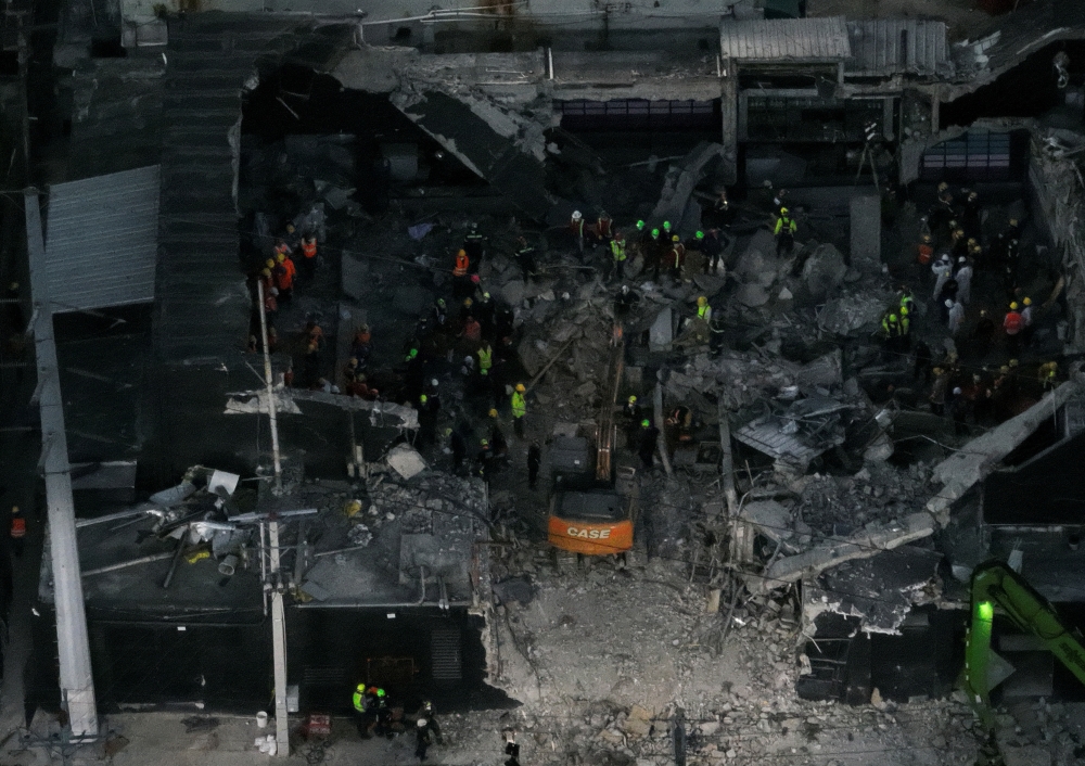 A drone view shows workers during recovery efforts at the site of the collapsed Jet Set nightclub in Santo Domingo, Dominican Republic, April 9, 2025. — Reuters pic