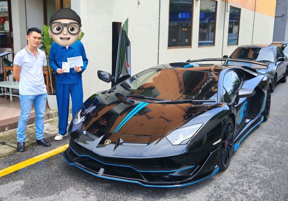 Member of Parliament for Kepong Lim Lip Eng’s assistant, Dic Lai (left) and Deng Sheng with his Lamborghini Aventador.