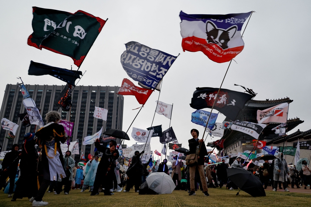 People attend a rally to celebrate the expulsion of South Korean President Yoon Suk-yeol in Seoul April 5, 2025. — Reuters pic