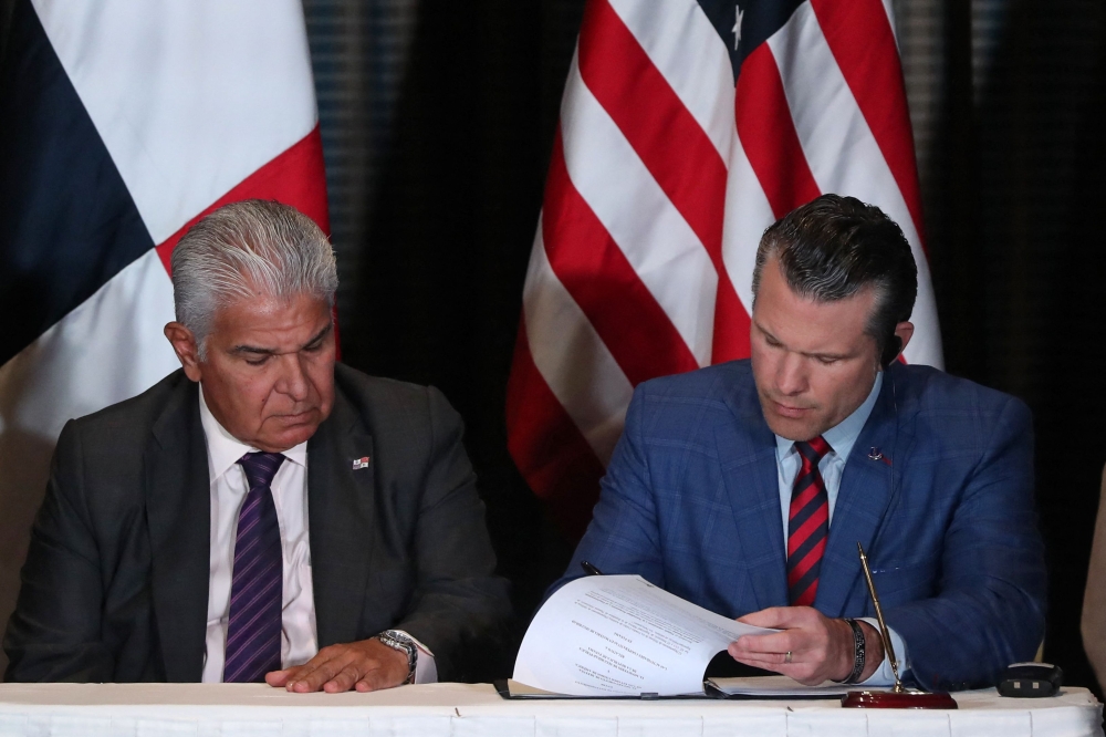 Panama’s President Jose Raul Mulino looks on as US Secretary of Defence Pete Hegseth signs a bilateral agreement, in Panama City April 9, 2025. Hegseth arrived in Panama for the regional security summit and to reinforce the Trump administration’s continued interest over the canal. — AFP pic