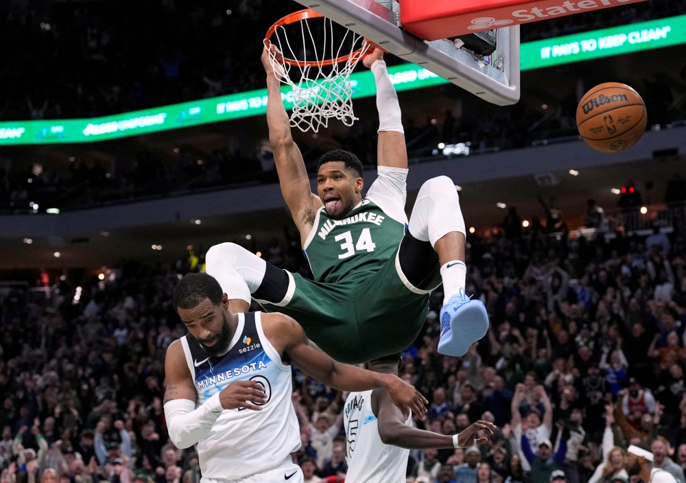 Milwaukee Bucks forward Giannis Antetokounmpo dunks against Minnesota Timberwolves guard Mike Conley in the second half at Fiserv Forum in Milwaukee, Wisconsin, on April 8, 2025. — Michael McLoone-Imagn Images pic