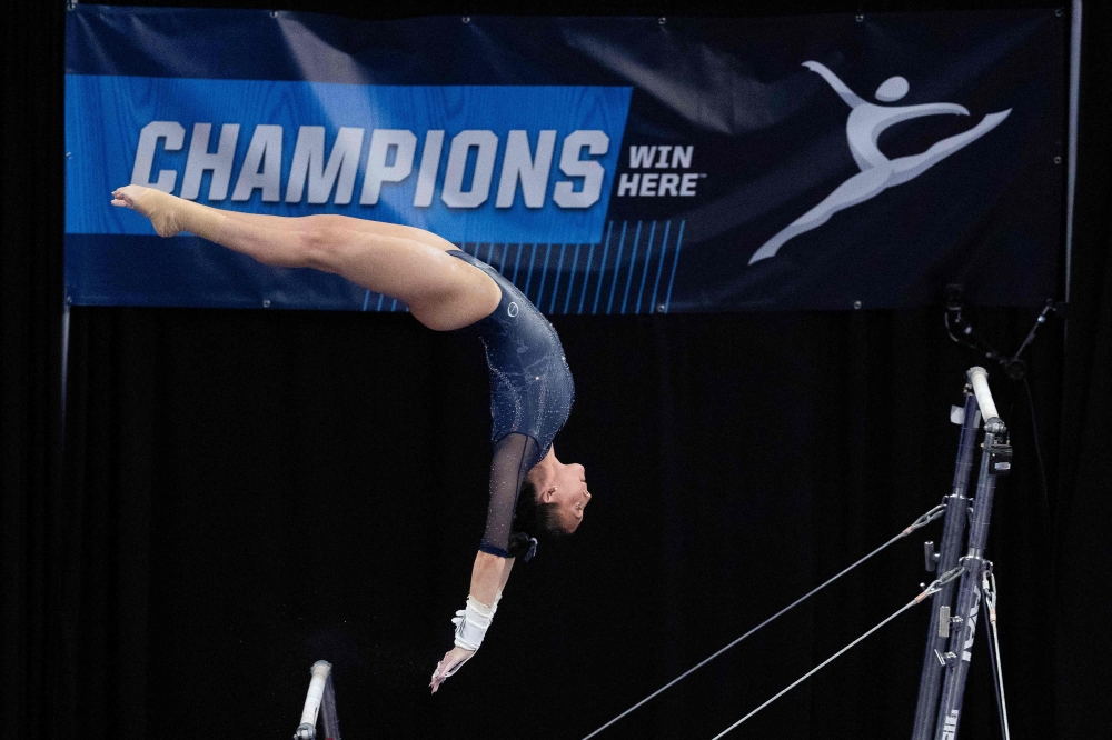 A gymnast is seen competing on the uneven bars during the NCAA Seattle Regional gymnastics meet at Alaska Airlines Arena on April 6, 2025. — Getty Images via AFP