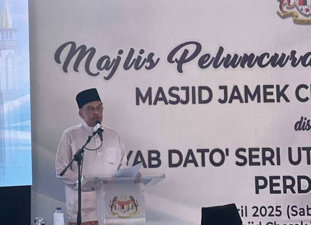 Prime Minister Datuk Seri Anwar Ibrahim gives his address during the groundbreaking for the reconstruction of the Majid Jamek Cherok Tokun in Seberang Perai April 12, 2025. — Picture by Opalyn Mok