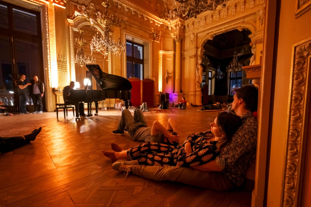 Enthusiasts listen a concert by Italian pianist and performer Marino Formenti, during an opera sleepover event at the Grand Theatre in Geneva on April 5, 2025. — AFP pic