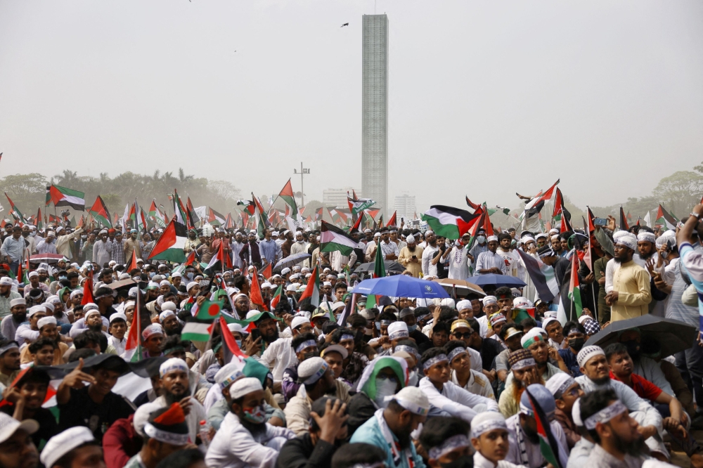 Muslims carry flags during a protest rally called March for Gaza, to express solidarity with Palestinians in Gaza, at Suhrawardy Udyan in Dhaka, Bangladesh, April 12, 2025. — Reuters pic 