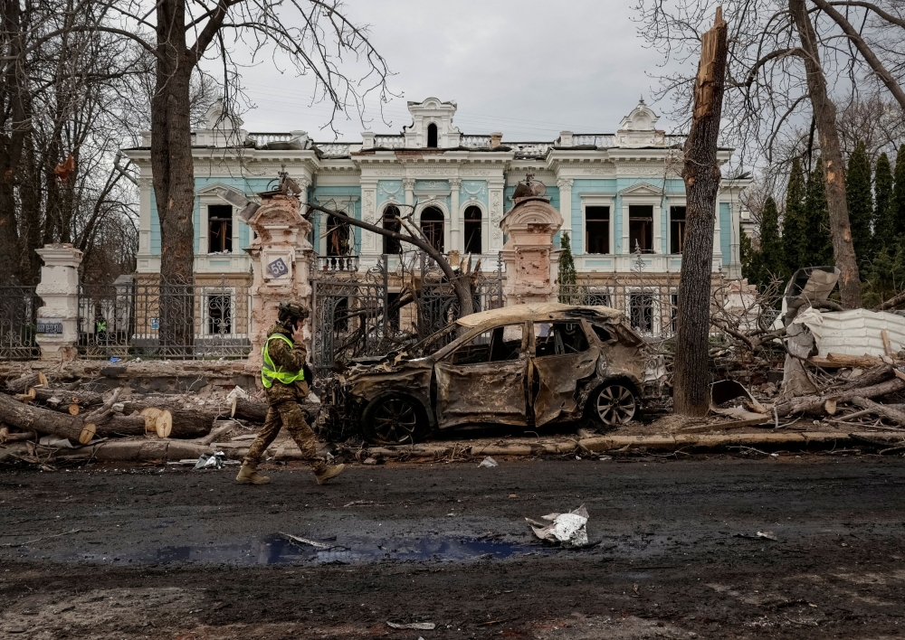 A Ukrainian serviceman walks at the site of a Russian missile strike, amid Russia’s attack on Ukraine, in Sumy, Ukraine April 13, 2025. — Reuters pic 