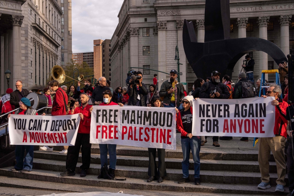 Demonstrators from Jewish Voice for Peace held an emergency Passover Seder outside of ICE headquarters yesterday. — AFP pic