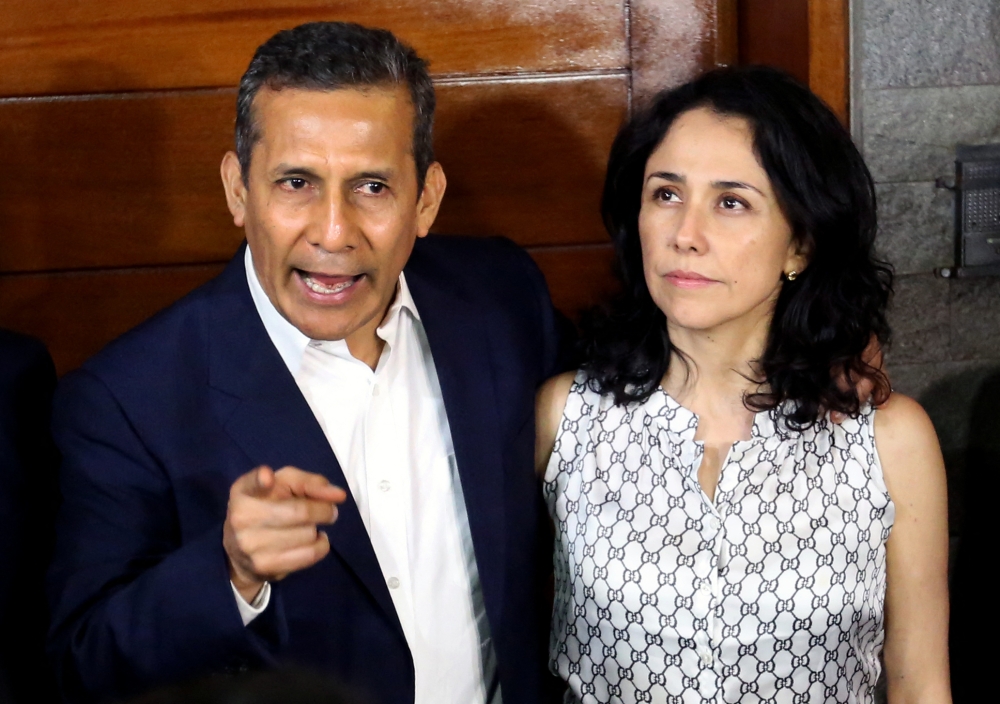Peru’s former President (2011-2016) Ollanta Humala speaks next to his wife Nadine Heredia outside their home after being released from preventative detention awaiting trial on charges of money laundering, in Lima April 30, 2018. Peru’s former first lady Nadine Heredia arrived in Brasilia yesterday, after receiving asylum from Lula’s government after being sentenced to 15 years in prison in her country for money laundering. — AFP pic