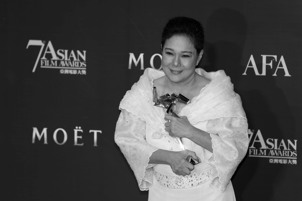 Nora Aunor poses with her trophy after winning the Best Actress award for the film ‘Thy Womb’ at the Asian Film Awards in Hong Kong March 18, 2013. — Reuters pic