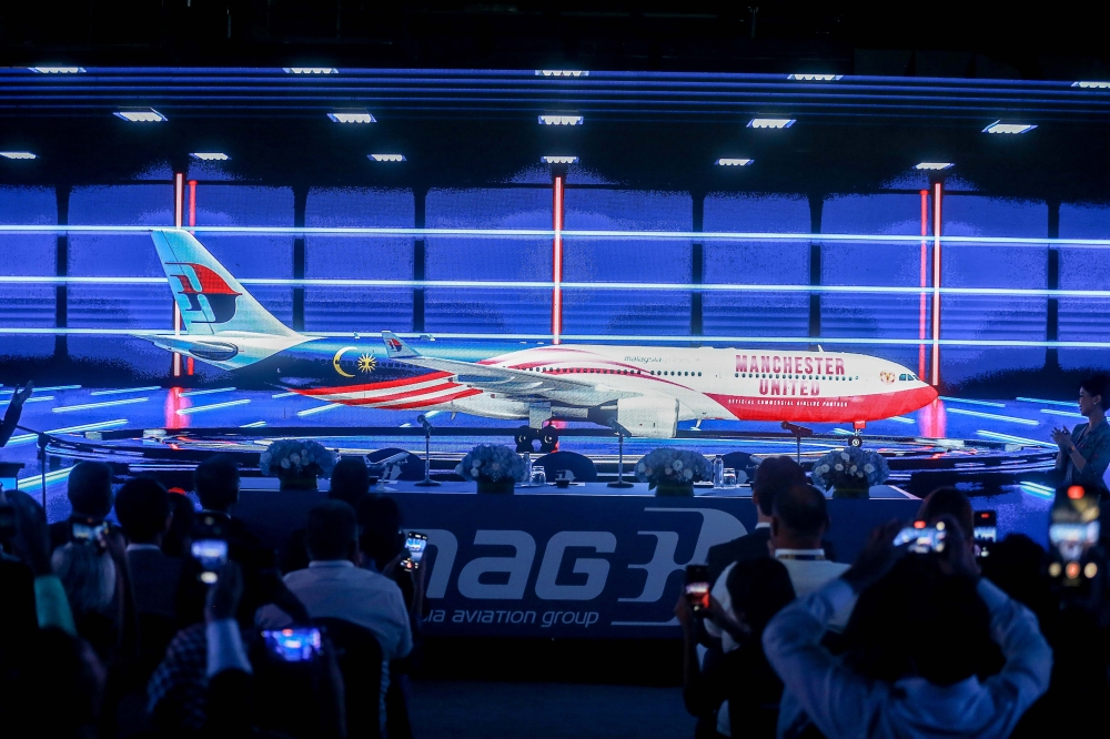 Malaysia Airlines unveils its special A330-300 livery in partnership with Manchester United at Malaysia International Trade and Exhibition Centre (Mitec) today. — Picture by Sayuti Zainudin
