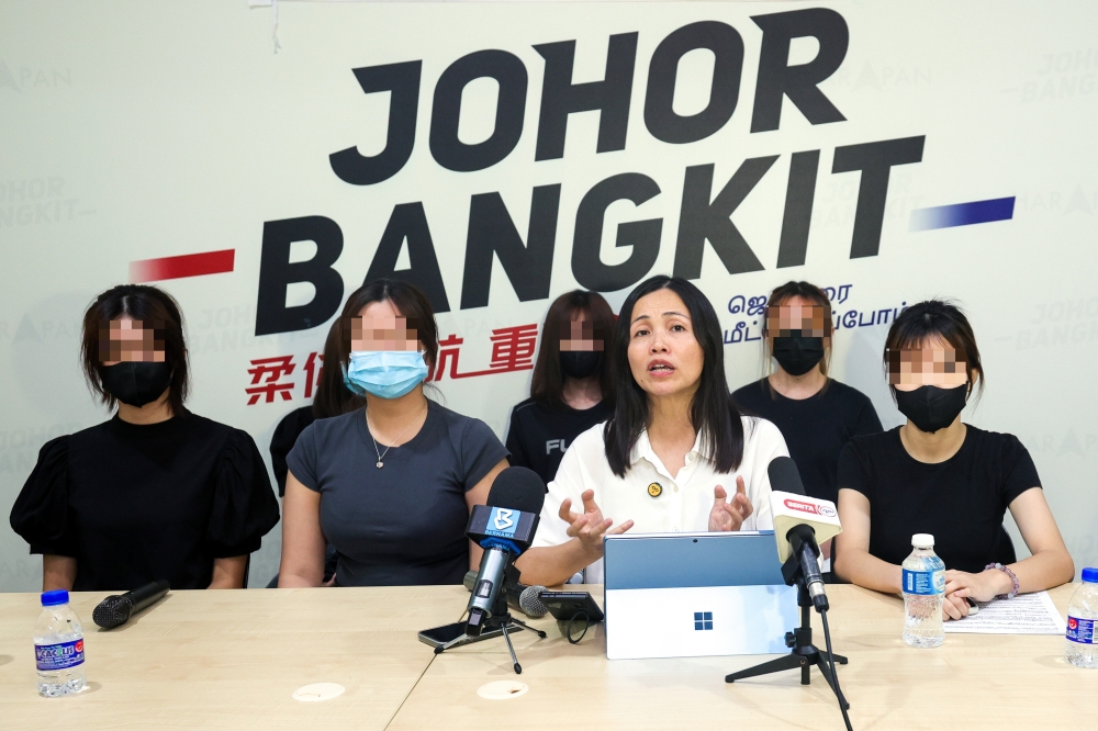 Deputy Minister of Communications and Kulai Member of Parliament, Teo Nie Ching (front row, 2nd right) speaks to the media about the deepfake photo case involving 18-year-old private secondary school students, at the Kulai Member of Parliament's Office, April 12, 2025. — Bernama pic
