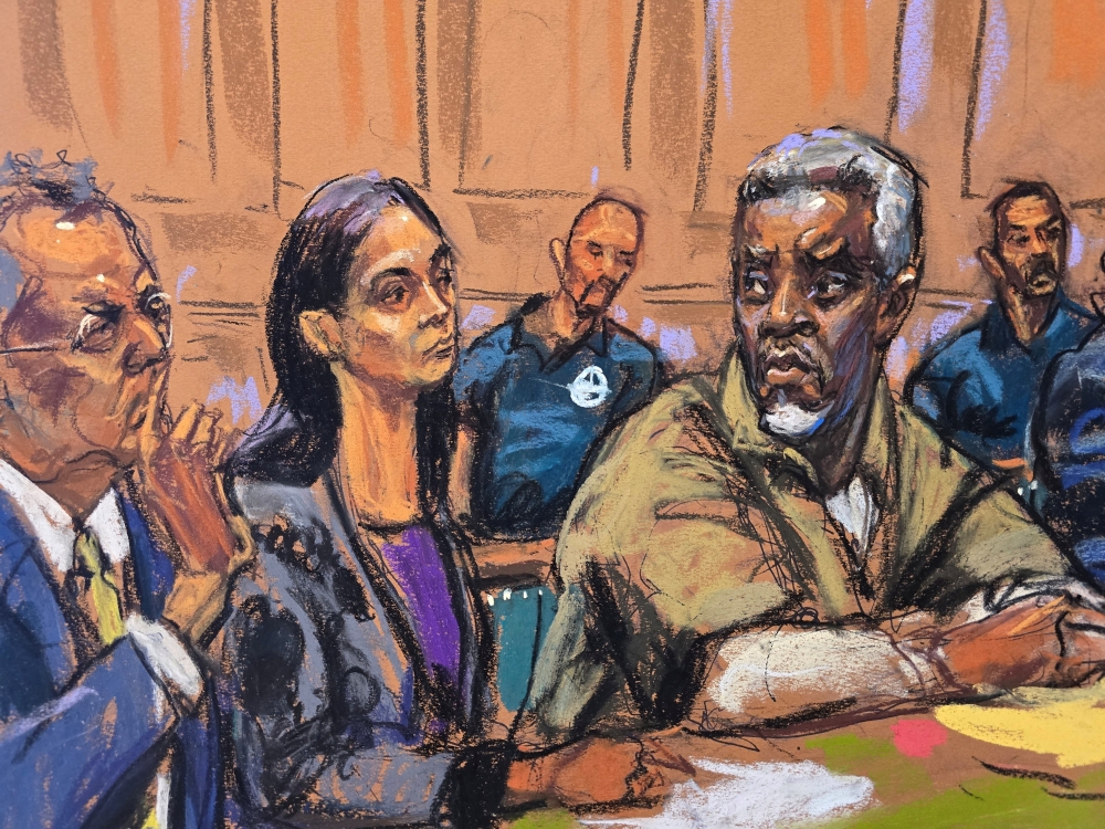 Sean 'Diddy' Combs sits with members of his defense team Marc Agnifilo and Teny Geragos,  for a conference ahead of his trial next month on sex trafficking charges, in New York, U.S., April 18, 2025, in this courtroom sketch. — Reuters pic