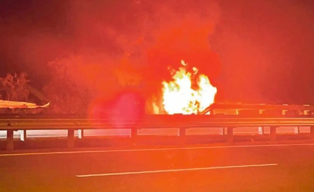 A vehicle burns after crashing at KM65.3 of the North-South Expressway. — Picture from Facebook/Khidmat Malaysia